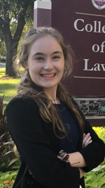 Portrait of professionally-dressed student smiling at camera